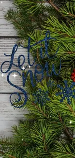 Rustic holiday wallpaper with pine branches, berries, and 'Let it Snow' text.