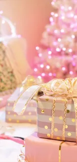 Pink-lit tree with gifts and ribbons