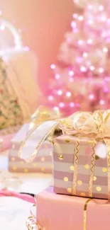 Pink festive gifts with glowing tree background.