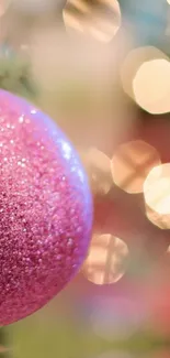 Glittering pink ornament with bokeh background.