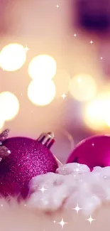 Pink ornaments with soft bokeh lighting on a festive holiday background.