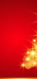 Red festive wallpaper with a glowing tree of gold stars.