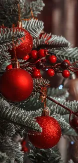 Christmas tree with red ornaments and berries.