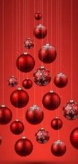 Red Christmas tree with baubles on mobile wallpaper.