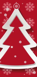 Stylized white Christmas tree on red background with snowflakes.