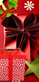 Red festive gift box with bows on a holiday-themed wallpaper.