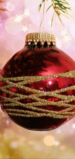 Vibrant red ornament with golden accents and holiday background.