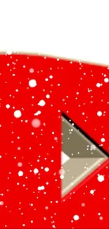 Red play button with snowy effect, festive theme.