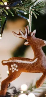 Festive reindeer ornament hanging on a Christmas tree with warm lighting.