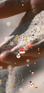 Hand holding sand with festive holiday icons.