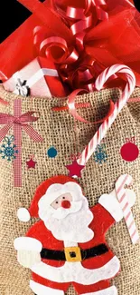 Santa-themed jute bag with gifts and candy canes for Christmas.