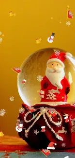 Santa snow globe on festive yellow background wallpaper.