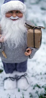 Charming Santa figurine on snowy ground with gift boxes, perfect for holiday decor.