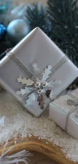 Silver gift boxes with pine branches and snowflakes on star tray.