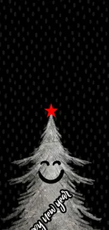 Smiling Christmas tree with a red star on black background.