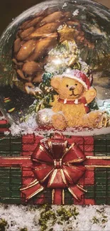 Snow globe with teddy bear and Christmas decor against a snowy backdrop.