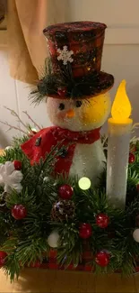 Festive snowman with candle centerpiece for holiday decor.