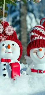 Cheerful snowmen in festive hats in snowy background.