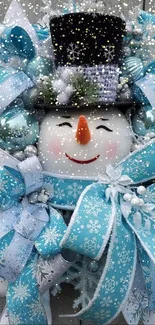 Snowman wreath with blue and white ribbons, perfect for winter.