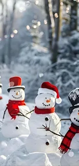 Joyful snowmen with scarves in winter landscape.