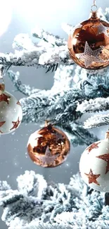 Snowy Christmas tree with starry ornaments.