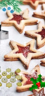 Festive star-shaped cookies with holiday decorations on a tray.