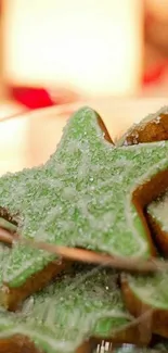 Green frosted star-shaped cookies in a festive setting.