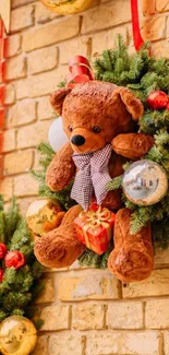 Festive teddy bear with Christmas decorations on a brick wall.