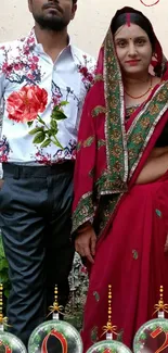 New Year wallpaper with couple in traditional red attire and festive design.