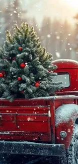 Red vintage truck with snowy Christmas tree in winter setting.