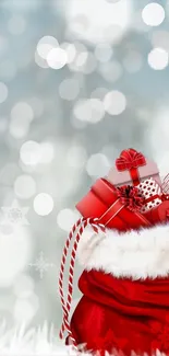 Christmas theme with red gifts and snow background wallpaper.