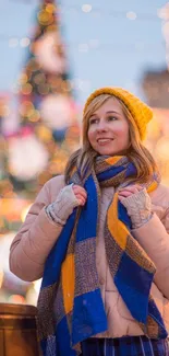 Woman in winter attire with a festive background.