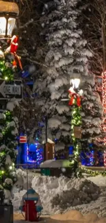 Snowy festive street scene with illuminated decorations.