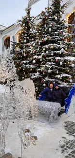 Snowy Christmas scene with festive decor and trees.