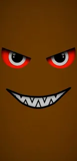 Brown monster face with red eyes and a mischievous grin on a dark background.