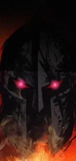 Warrior mask with fiery red eyes on dark background wallpaper.