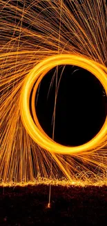 Abstract fiery light circle in motion on dark background.