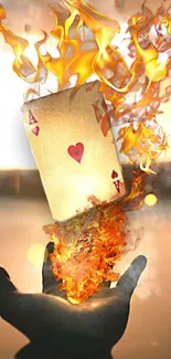 Hand holding fiery ace card with flames rising.