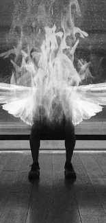 Abstract winged figure in black and white ambiance.