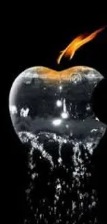 Fiery apple splash on a dark background wallpaper.