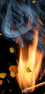 Orange flames and smoke with autumn leaves on a dark background.