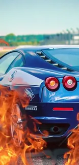 Blue sports car with flames in action, perfect for phone wallpaper.