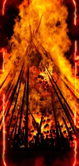 Bonfire with tall orange flames against a dark night sky.