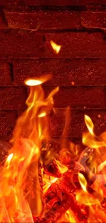 Vibrant orange flames dance against a textured brick wall.