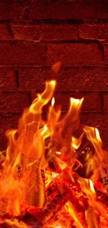 Fiery wallpaper with flames against a brick wall.
