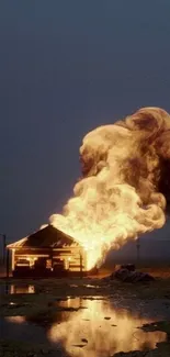 Mobile wallpaper featuring a cabin engulfed in flames under a dark blue sky.