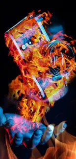 Camera engulfed in vibrant flames, held by a hand, on a mobile wallpaper.