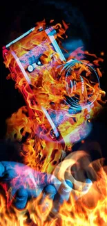 Artistic wallpaper of a fiery camera in hand with vibrant flames.