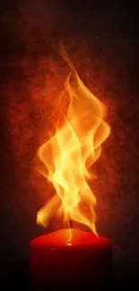 A vibrant candle flame against a dark background.