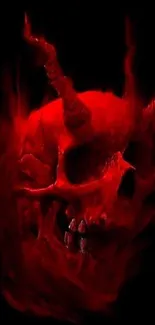 Fiery red demon skull with sharp horns on black background.